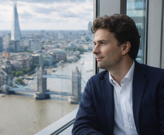Luke is looking through a window at Thames